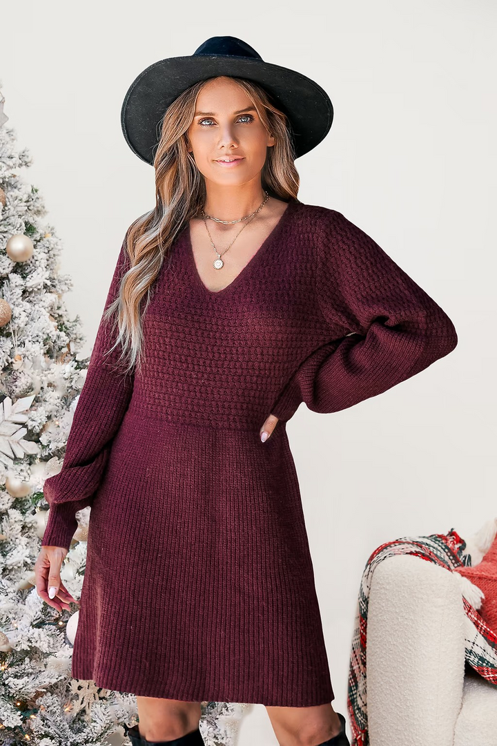 Short knitted dress with a V-neck